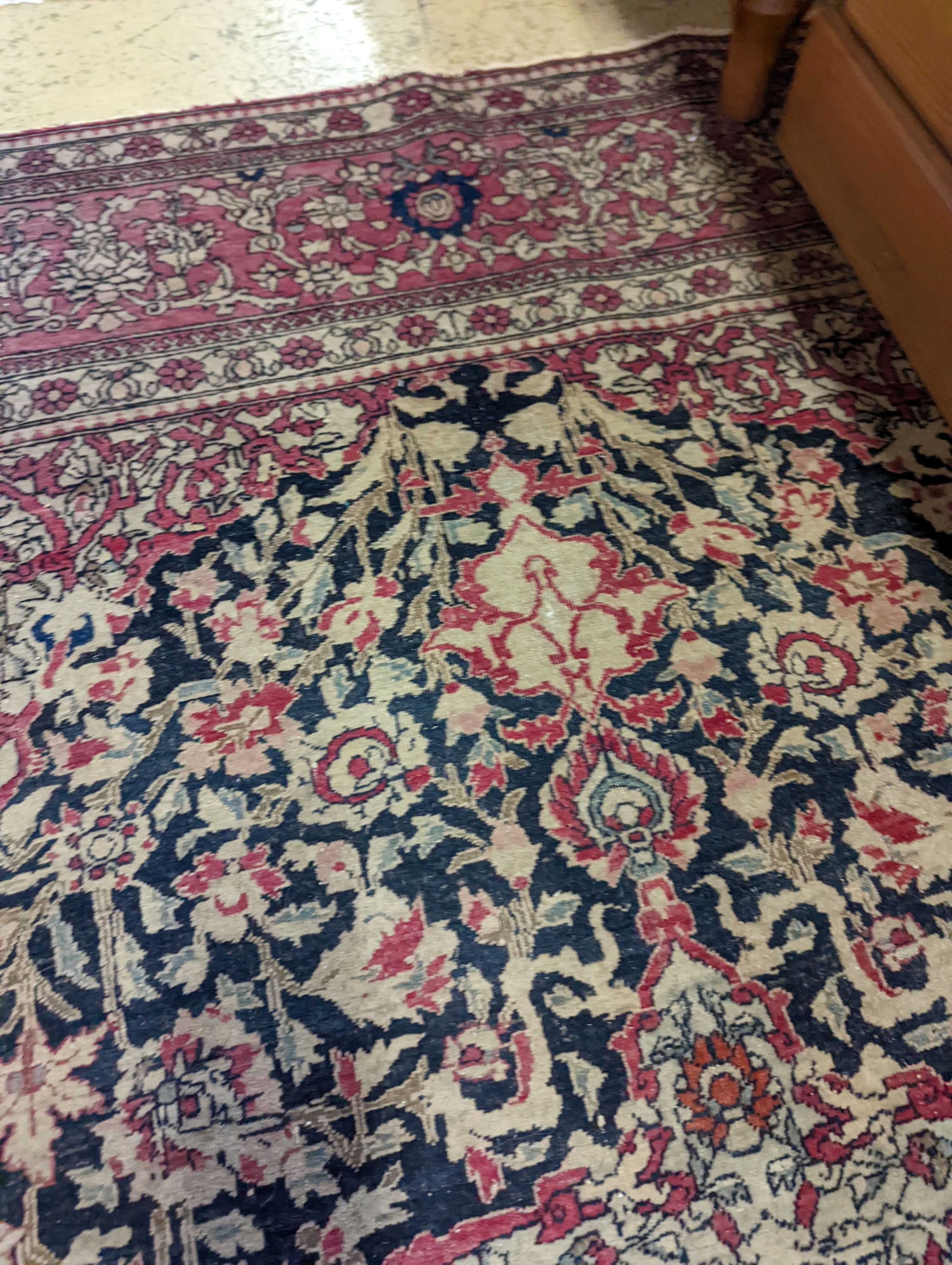 An Isphahan black ground rug with central foliate medallion, mulit-bordered, 202 x140cm